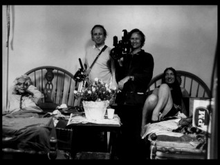 Documentarian brothers The Maysles are photographed between the Beales in this scrapbook image.