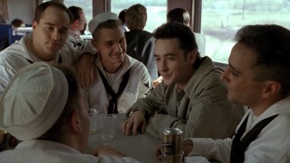 Roy Dillon (John Cusack) uses loaded dice to con sailors (including a balding young Jeremy Piven) on a train.