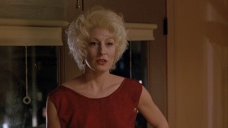 Platinum blonde Lilly (Anjelica Huston) turns to her son for help.
