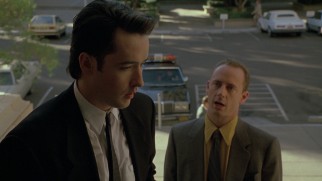 A Phoenix police lieutenant (Xander Berkeley) asks Roy (John Cusack) to identify a dead body.