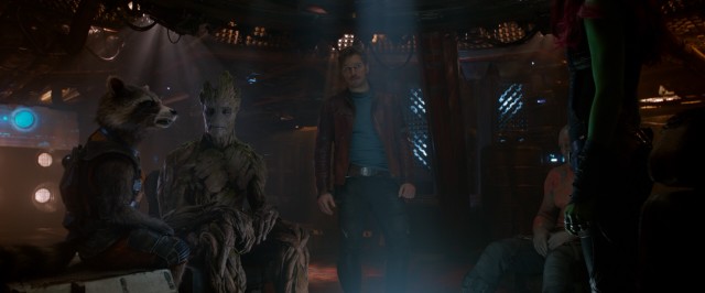 The Guardians of the Galaxy -- Rocket, Groot, Star-Lord, Drax, and Gamora -- discuss the part of a plan they've formulated.