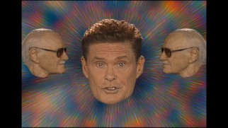 A pair of Stan Lee heads surround David Hasselhoff in the "Guardians Inferno" music video.