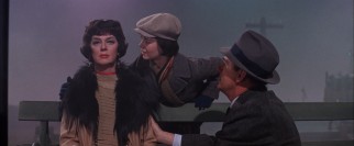 Rose (Rosalind Russell) receives life-changing news in silence at a gloomy train station.