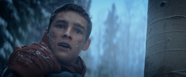 Jonas (Brenton Thwaites) journeys to places of varied weather in the climax of "The Giver."