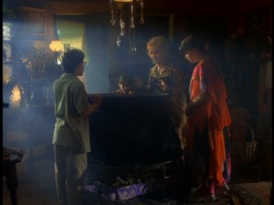 The Cromwell clan gather 'round Grandma Aggie's cauldron to see some answers. 