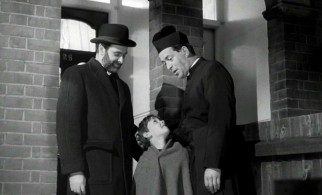 A rabbi, a priest, and a boy... it's not the set-up to a joke, but the fairly satisfying end to "Hand in Hand."