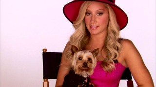 Sharpay (Ashley Tisdale) sits with Boi (her Yorkie dog) while telling us about (and showing us scenes from) the upcoming HSM spin-off movie "Sharpay's Fabulous Adventure."