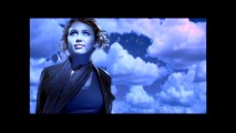 Miley Cyrus looks up and smiles at the night sky tinting everything blue (except that unnecessary border) in her music video for "The Climb."