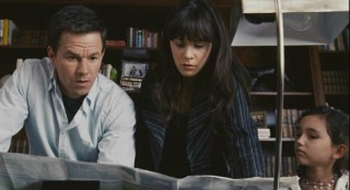 Elliot (Mark Wahlberg), Alma (Zooey Deschanel), and Jess (Ashlyn Sanchez) scour a map to determine the nearest city that has yet to be infected.