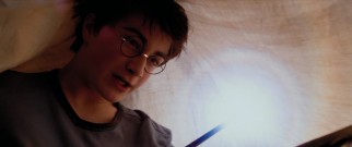 Under the bed covers, now 13-year-old student wizard Harry Potter (Daniel Radcliffe) experiments with wand control.