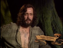 Gary Oldman shows off some of the Azkaban prison tats on his chest in the makeup-minded featurette "Conjuring a Scene."