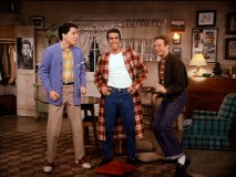 Fonzie cracks a big, wide smile as Ralph and Potsie excite him with the idea of singing.
