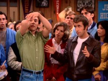 Fonzie is among the excited Arnold's crowd looking on as his normally klutzy cousin Angie (Charles Galioto) tries to set a world record for catching quarters off his elbow.
