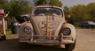 Dirty and in a junkyard, Herbie has seen better days when Maggie encounters him.