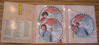 The Digipak inside folds open to hold the three discs.