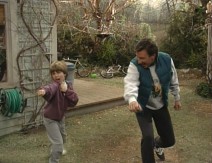 Mark and Tim practice their karate moves together in the Taylors' backyard.