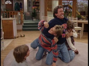 Tim wrestles with the boys.