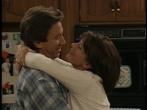 Tim and Jill embrace.