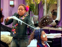 Raven struggles to remove a rubber glove that has fused itself to Alana's painted hair via chewing gum in "Run Raven Run."