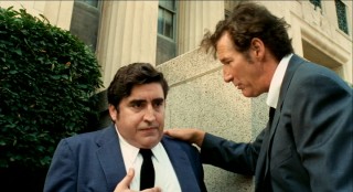 After swiping a confidential file, palpitating Dick Suskind (Alfred Molina) needs some calming down from his partner in crime.