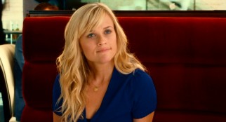 Freshly-cut Team USA softball player Lisa Jorgenson (Reese Witherspoon) tries to put on a happy face through a disastrously-timed first date in "How Do You Know."