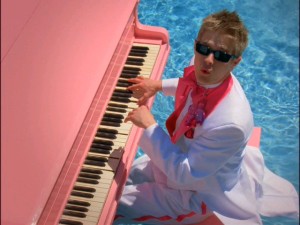 Lucas Grabeel tries the Elton suit on for size in "Fabulous".