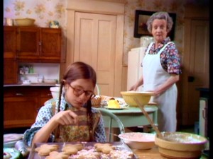 Addie and Grandma (Mildred Natwick) talk turkey while baking gingerbread cookies.
