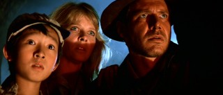 Short Round (Jonathan Ke Quan), Willie, and Indy take a dramatic look at the eponymous Temple of Doom.