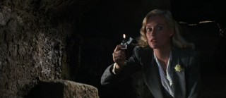 Illuminating with her lighter, Elsa Schneider (Alison Doody) appears to be both helpful and a love interest to Indy.