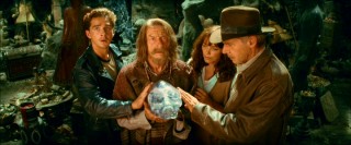 Mutt, Ox (John Hurt), Marion, and Indy huddle around the magnetically-charged crystal skull.