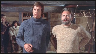 Ivarsson and Ross show their sweaters off to their new Viking friends.