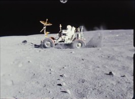 One of the astronauts goofs around on the lunar rover.