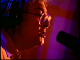 Randy Newman's "Good News" music video affords you an up-close and personal look at the singer-songwriter, though his portions are now windowboxed in contrast to the 16:9 film clips.