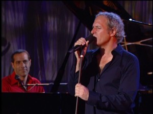 Like the rest of us, Brickman is in awe of his vocal accompaniment here, though a little perplexed by the new look. Is that really Michael Bolton?!