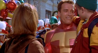 Few endings are as awful as "Jingle All the Way"'s overdone Wintertainment Parade climax which finds Arnold playing Turbo Man. Unmasked here, he carries Young Anakin Skywalker a.k.a. Jake Lloyd.