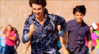 Kevin Jonas leads his two brothers in a high-speed getaway to a rooftop helicopter. Good thing theater owners didn't experience similar adolescent girl stampedes to see "Jonas Brothers: The 3D Concert Experience."