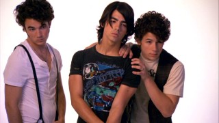 Kevin stays away while Nick and Joe Jonas get close to one another in photo shoot footage from "Up Close and Personal with the Jonas Brothers."