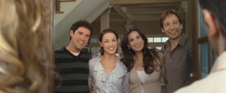 The Joneses are all smiles as they welcome two next-door neighbors into their seemingly perfect home and life.
