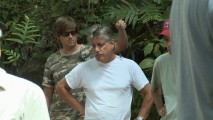 This unidentified prop guy gets a real kick of placing a fake spider on his fellow crew members' shoulders.