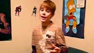 Taking his place between 2Pac and Bart Simpson, a young Justin Bieber covers Chris Brown's "With You" in one of his earliest YouTube videos (viewed over 30 million times to date).