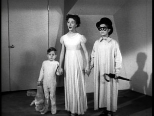 Kathryn Beaumont stands between Tommy Luske (left) and Paul Collins (right), who voiced and modeled for Wendy's younger brothers Michael and John Darling, respectively.