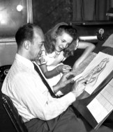 As Alice, Kathryn Beaumont checks up on an animator's rendering.