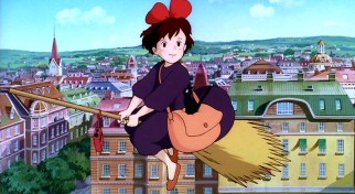 Kiki, 13-year-old witch in training, is impressed with European seaside city Korinko, here admiring its clock tower.
