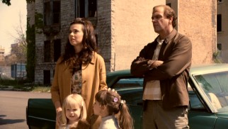 Danny's wife Joan (Linda Cardellini) is unimpressed by the slummy neighborhood their young family will next call home.
