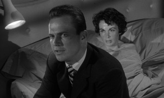 Sweaty secretary Velda (Maxine Cooper) clearly has eyes for Mike Hammer (Ralph Meeker), but his mind is on milk and other more important matters.