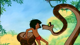 The cunning python snake Kaa tries to entrance Mowgli with his hypnotic swirling eyes.