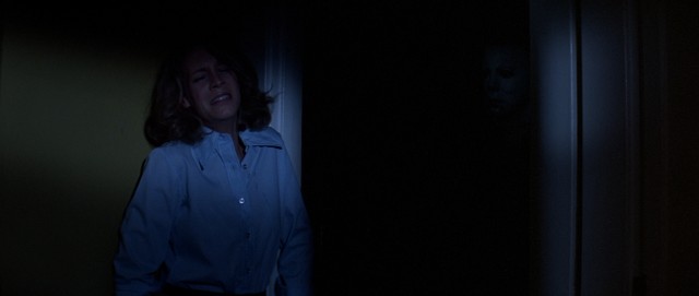 Look closely and you'll catch a glimpse of the mask of the man terrorizing Laurie Strode (Jamie Lee Curtis).