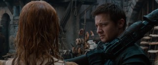 Hansel (Jeremy Renner) performs an ocular patdown, clearing an accused with on the basis of her dental hygiene.