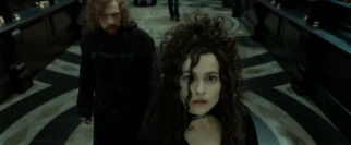 Hermione poses as wicked Bellatrix Lestrange (Helena Bonham Carter) while Ron dons a goatee as part of an effort to get in the vaults of Gringotts.