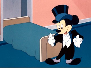 Mickey gets dressed up (needlessly) for his delayed dancing date with Minnie.